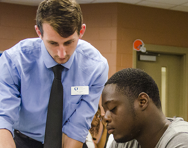 FGCU student instructing another student